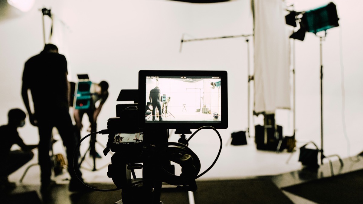 Executive being coached in front of a video camera