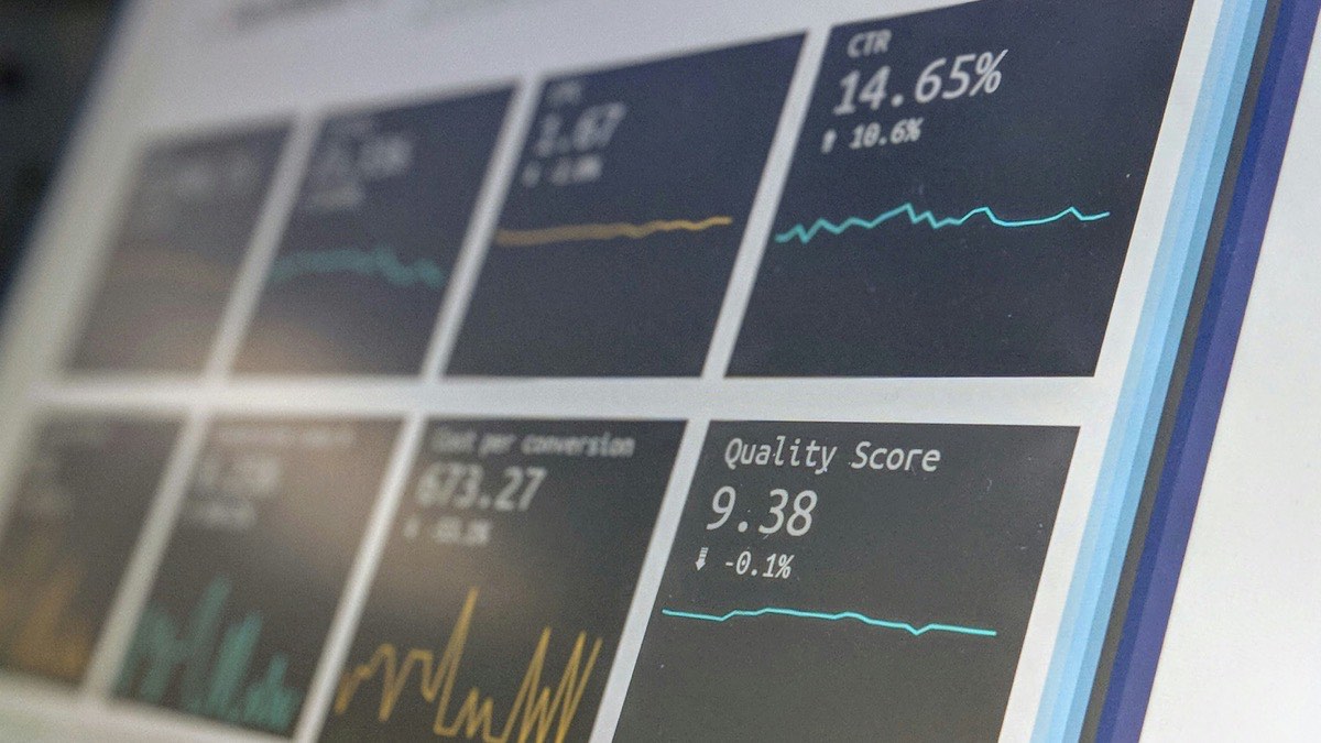 Team reviewing a SaaS product dashboard on a screen